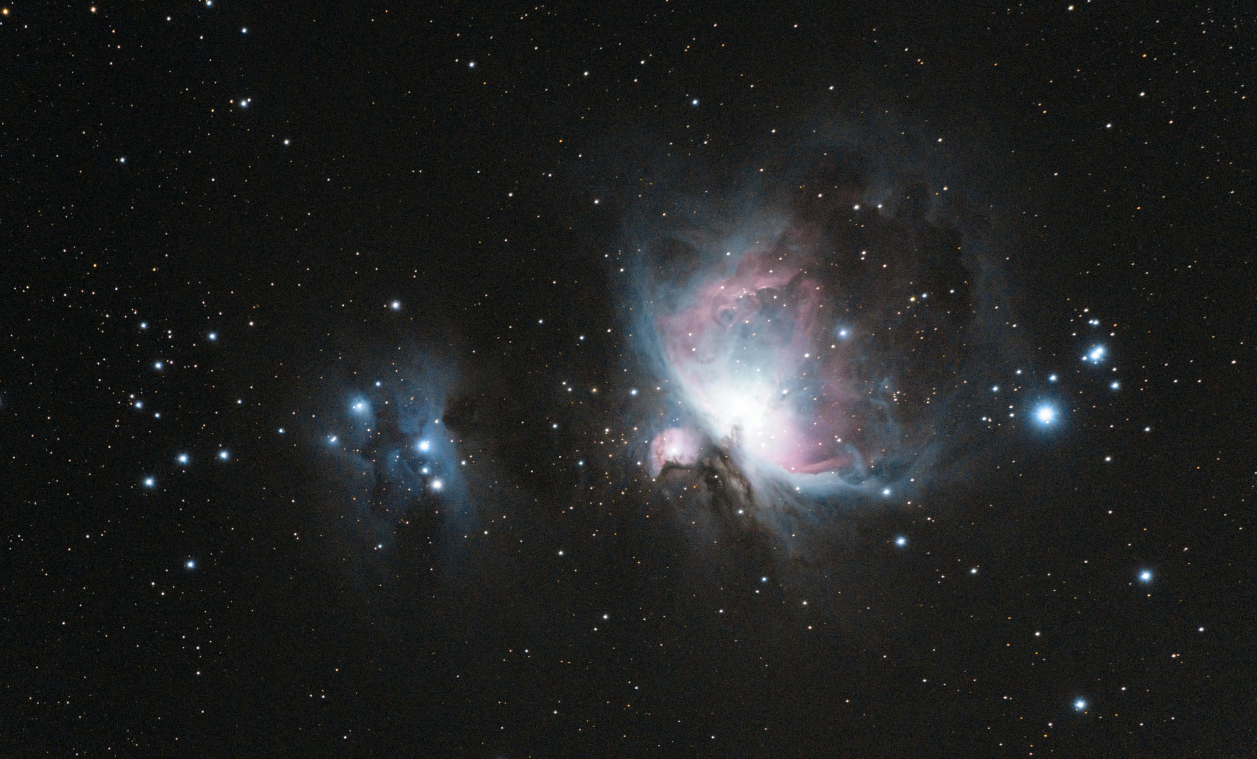 Capture of the Orion Nebula (M42) with stars and galaxies in a celestial scene.