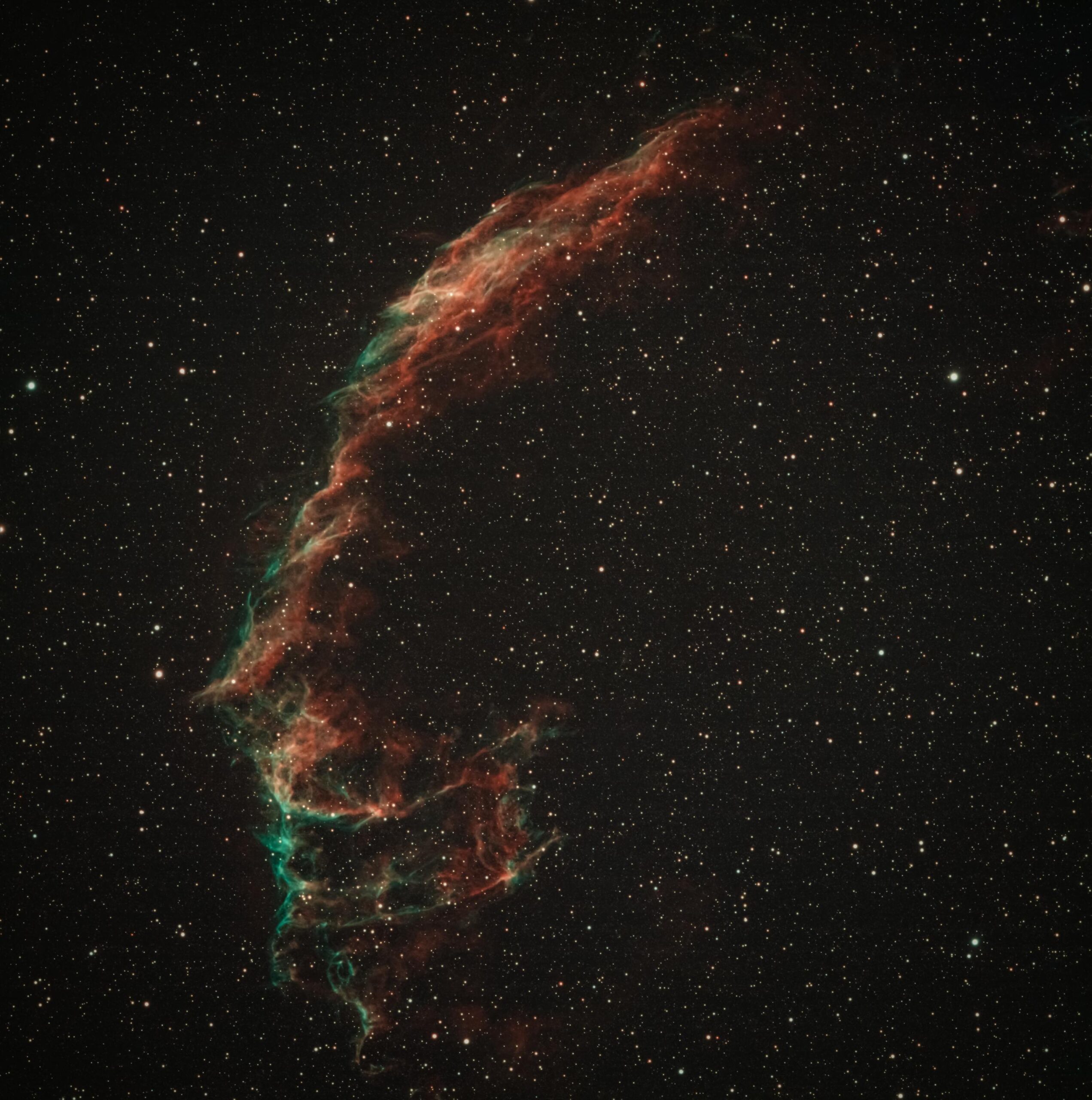 Marvel at the breathtaking detail of the Veil Nebula set against the star-filled cosmos.